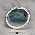 The "Lobelia" band in platinum, featuring three rectangular gemstones, is displayed upright against a textured blue stone background with the Earth's Treasury logo at the bottom.