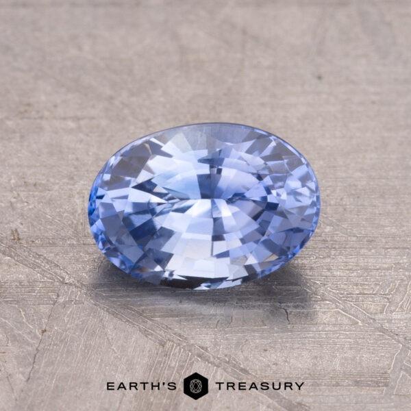 1.45-Carat Ceylon Sapphire (Heated) A 1.45-carat Ceylon sapphire, heat-treated, rests on a textured surface.