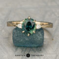 The Sylph Ring featuring a 1.61-Carat Teal-Green Particolored Australian Sapphire in 14K Yellow Gold
