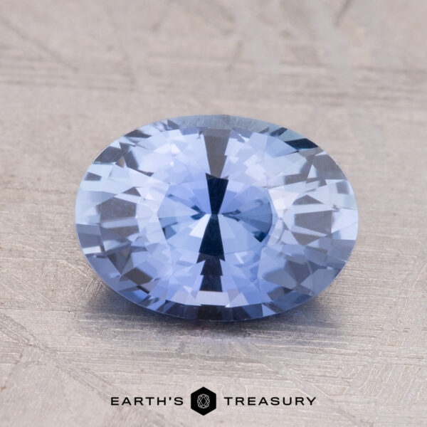 2.19-Carat Ceylon Sapphire A 2.19-Carat Ceylon Sapphire with a round shape rests on a textured light surface.