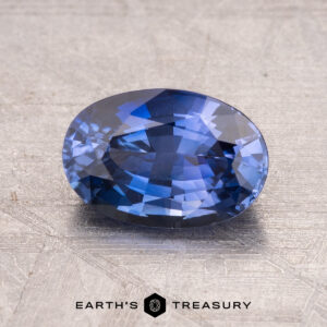 1.75-carat Ceylon sapphire (heated) on a textured surface.