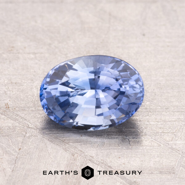 1.45-Carat Ceylon Sapphire (Heated) A 1.45-carat Ceylon sapphire, heat-treated, rests on a textured surface.