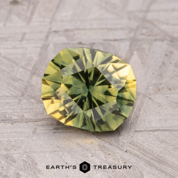 1.46-Carat Australian Sapphire (Heated) A 1.46-carat Australian sapphire (heated) is displayed on a light textured surface.