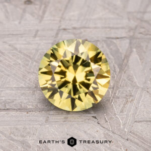 1.15-Carat Australian Sapphire (Heated) showcased on a textured gray surface.