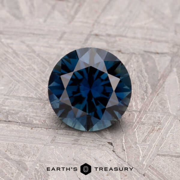 1.01-Carat Australian Sapphire (Heated) 1.01-carat Australian sapphire (heated) set against a textured gray surface.