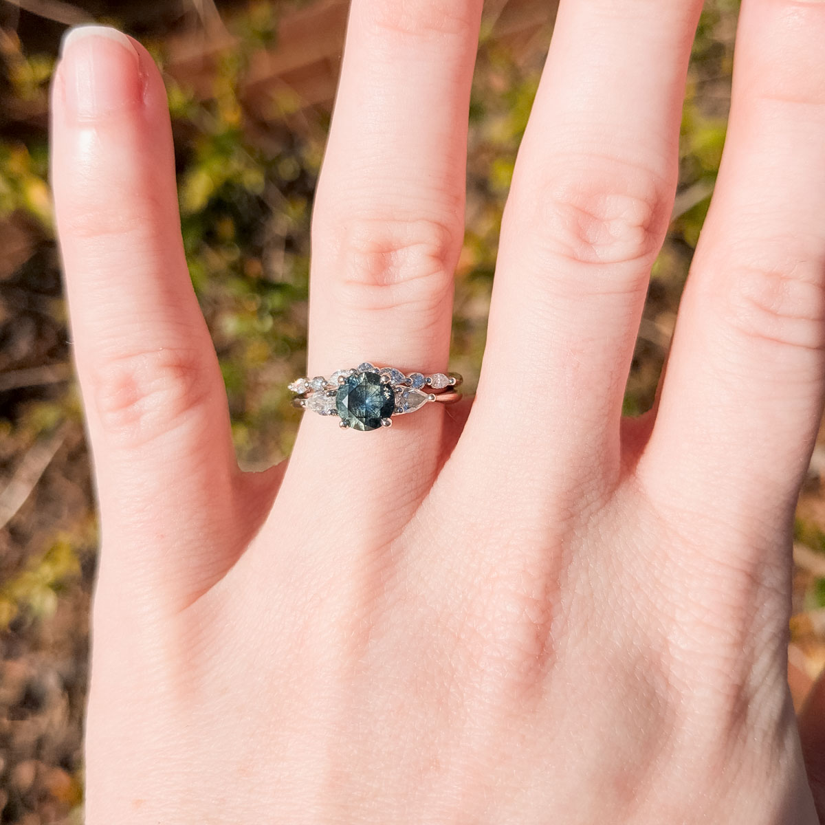 The "Multiflora" ring in 14K white gold with 0.94-carat Montana sapphire, alongside the contour "Orinoco" band in 14K white gold
