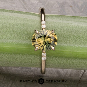 The Kyria ring featuring a 1.56-Carat Yellow-Green Particolored Australian Sapphire set in 14k yellow