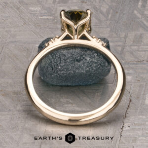 The Kyria ring featuring a 1.56-Carat Yellow-Green Particolored Australian Sapphire set in 14k yellow