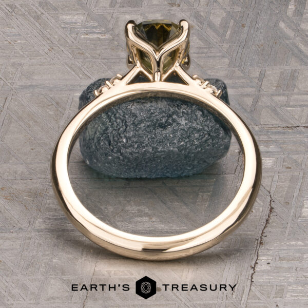 The Kyria ring featuring a 1.56-Carat Yellow-Green Particolored Australian Sapphire set in 14K Yellow Gold The Kyria ring featuring a 1.56-Carat Yellow-Green Particolored Australian Sapphire set in 14k yellow