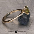 The Kyria ring featuring a 1.56-Carat Yellow-Green Particolored Australian Sapphire set in 14k yellow