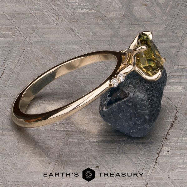 The Kyria ring featuring a 1.56-Carat Yellow-Green Particolored Australian Sapphire set in 14K Yellow Gold The Kyria ring featuring a 1.56-Carat Yellow-Green Particolored Australian Sapphire set in 14k yellow