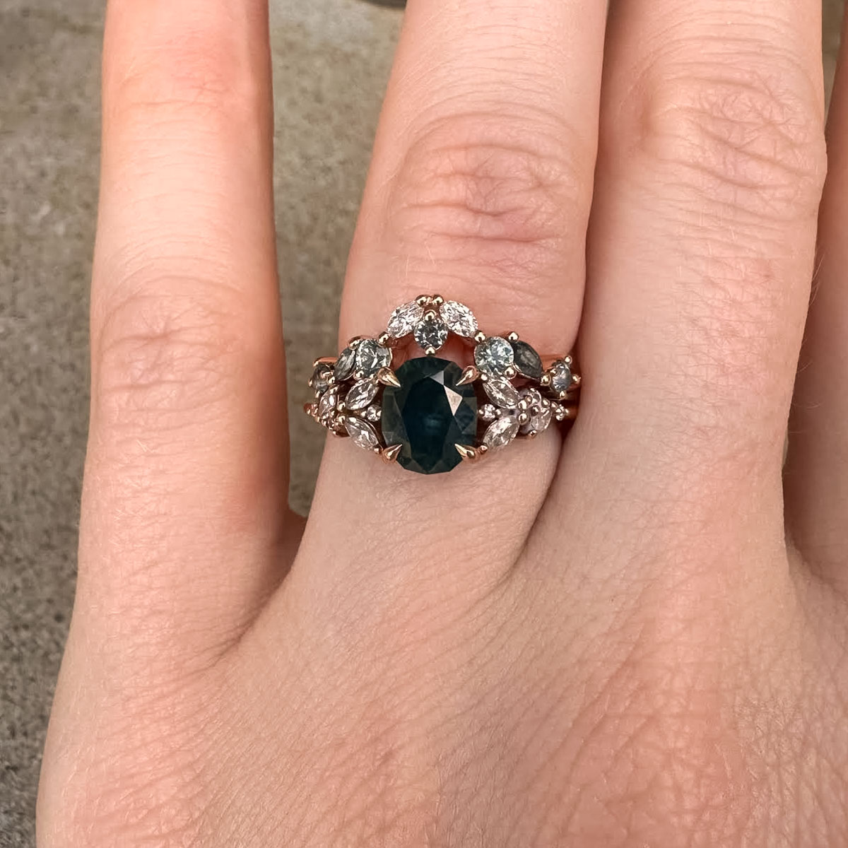 The "Holly" ring in 14k rose gold with 1.43-carat Montana sapphire, alongside a modified "Holly" band in 14k rose gold