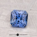 A 1.27-carat Ceylon Sapphire (heated), expertly square-cut with intricate faceting, sits on a textured surface with the words "EARTH'S TREASURY" below.