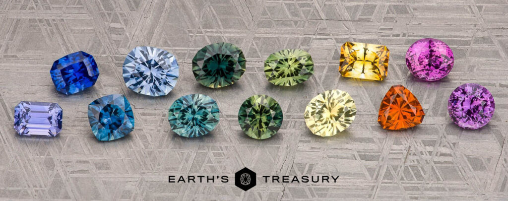 Twelve faceted gemstones in assorted shapes and colors are displayed in a row on a textured gray background above the product name "887ee3d0-8498-4964-b766-08be22b1d5e7".