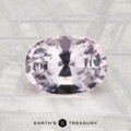 A 1.98-carat oval-cut pale pink spinel is displayed on a textured gray surface with "Earth's Treasury" at the bottom.