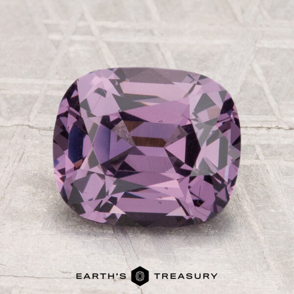 2.88-Carat Spinel A 2.88-carat, cushion-cut purple Spinel gemstone is shown on a textured surface with the text "EARTH'S TREASURY" below it.