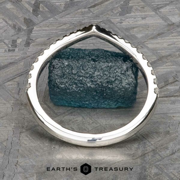 The Chevron Tapered Pave Diamond Band in platinum The Chevron Tapered Pave Diamond Band in platinum is displayed upright on a gray textured surface, with the "EARTH'S TREASURY" logo and text at the bottom.