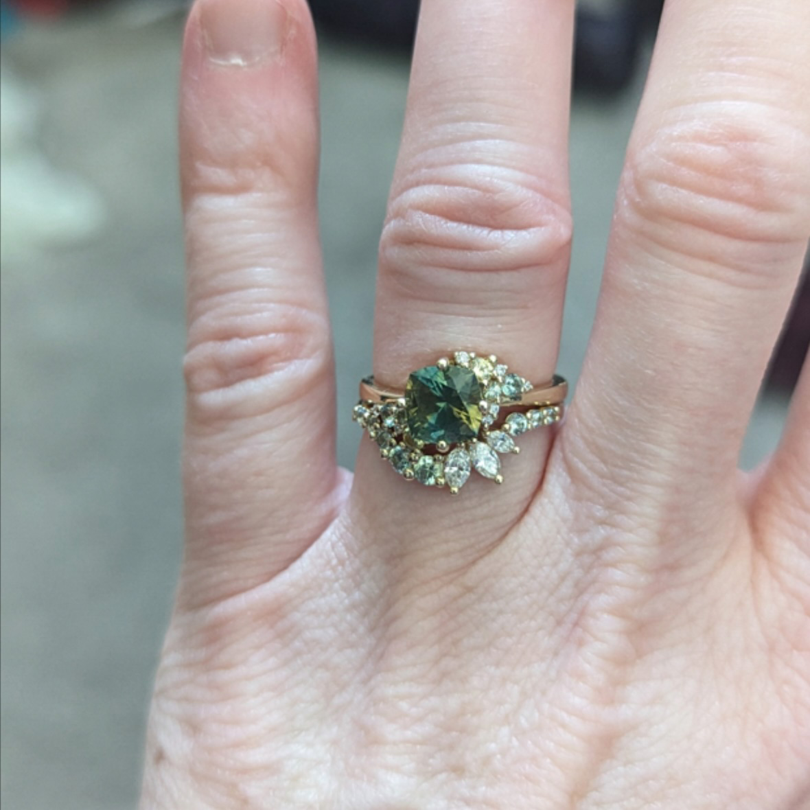 The Deluxe "Nebula" ring in 14K yellow gold with 1.69-carat Montana sapphire, alongside the "Melisani" band in 14K yellow gold