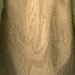Close-up of Ripple 4's old, weathered stone surface featuring a faintly carved decorative pattern or symbol.