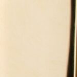 Close-up of the smooth, beige-colored surface of Smooth Polish with a vertical, dark edge on the right side.