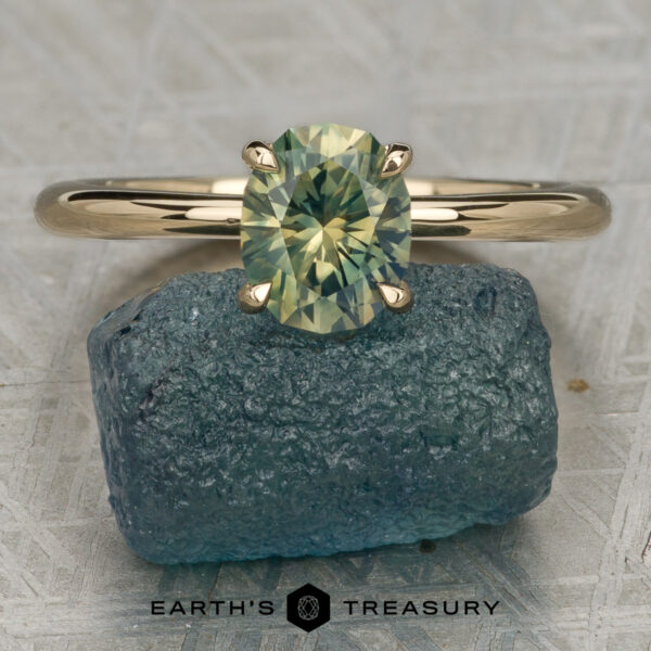 The Begonia Ring featuring a 1.17-Carat Yellow-Green Particolored Australian Sapphire set in 14K Yellow Gold The Begonia Ring featuring a 1.17-Carat Yellow-Green Particolored Australian Sapphire set in 14K Yellow Gold