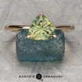 The Begonia Ring featuring a 1.79-Carat Green-Yellow Particolored Australian Sapphire set in 14K Yellow Gold