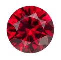 A brilliant-cut, round faceted ruby-icon gemstone is shown from above on a white background.
