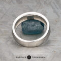 A "Stacked from 56 images. Method=B (R=9,S=4)" ring is displayed upright around a rough blue stone on a textured metallic surface, with the text "Earth's Treasury" at the bottom—a nod to elegance inspired by Matterhorn’s timeless allure.