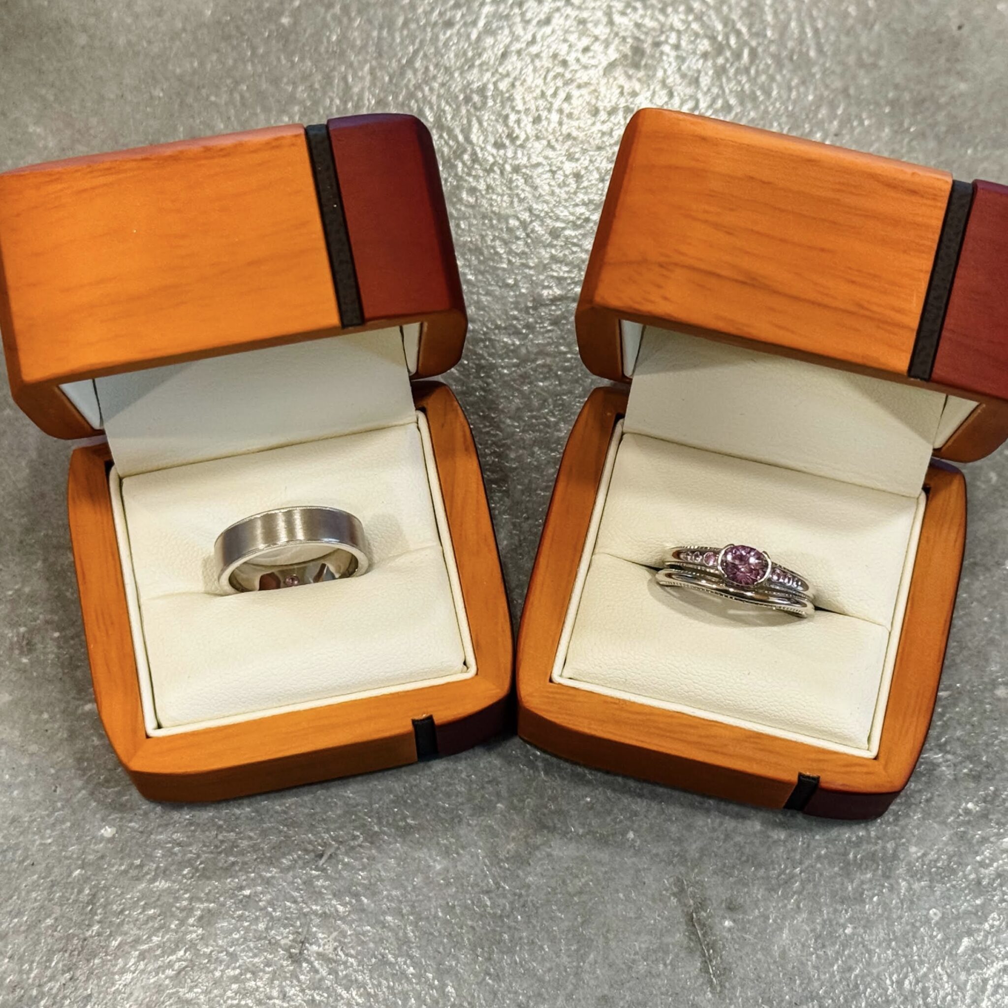 Left: the Rainier ring in 14K white gold. Right: custom ring in band in plaitnum with 1.05-carat Montana sapphire.