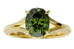 The ring-split-shank features an oval-shaped green gemstone at the center, accented by small diamonds along its gold split shank band.