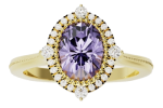 The ring-vintage-inspired features an oval-cut purple gemstone in the center, accented by a halo of small round white diamonds for a timeless, elegant look.