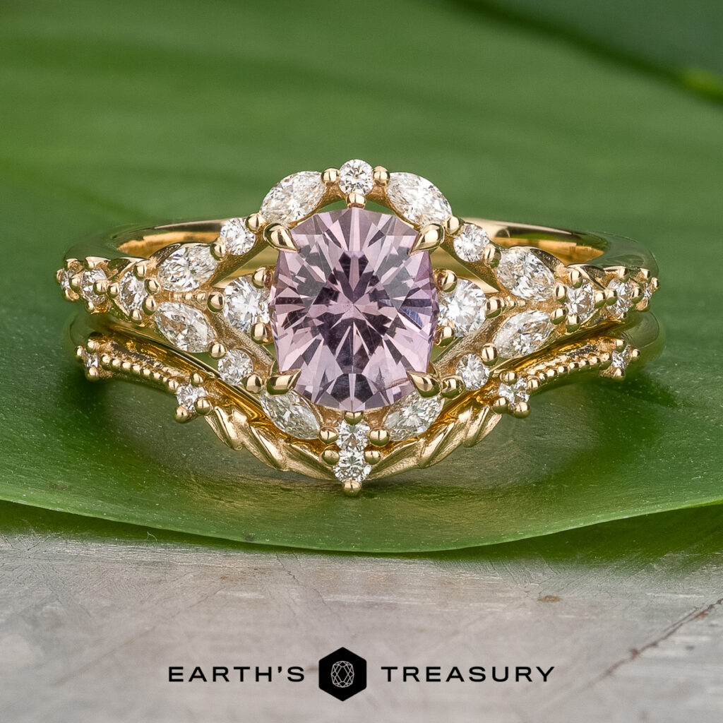 The "Stacked from 16 images. Method=B (R=11,S=7)" gold ring features a pink center gemstone and marquise-shaped white stones, displayed on a green leaf with the "Earth's Treasury" logo below.