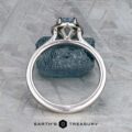 The "Alice" ring in platinum with a 1.09-carat Montana sapphire displayed on a rock.