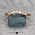 The "Hesperia" band in 20K pink gold displayed on a rock.