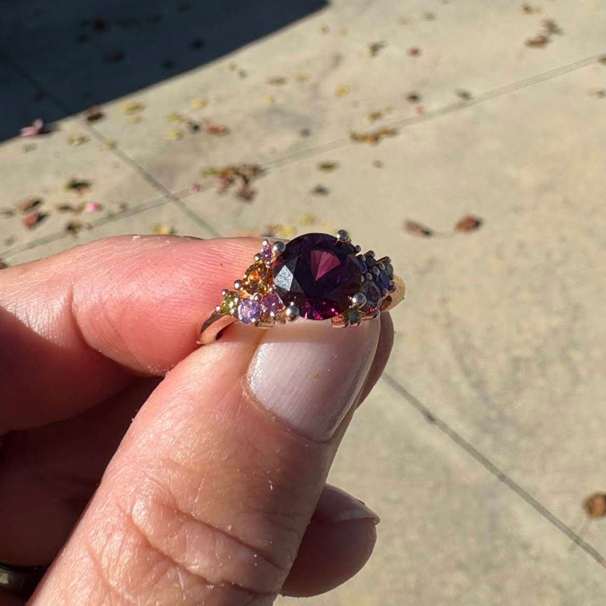 Custom cluster ring in 20K pink gold with 2.55-carat rhodolite garnet