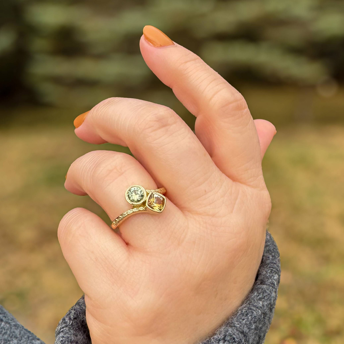 Custom ring in 14K yellow gold with 0.76-carat yellow Montana sapphire and 0.61-carat green Montana sapphire
