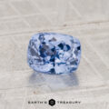 A 1.50-carat faceted Ceylon Sapphire rests on a textured surface, with the "EARTH'S TREASURY" logo displayed at the bottom of the image.