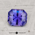 A faceted, rectangular 1.63-Carat Ceylon Sapphire in violet-blue is shown on a light textured surface with "EARTH'S TREASURY" beneath.