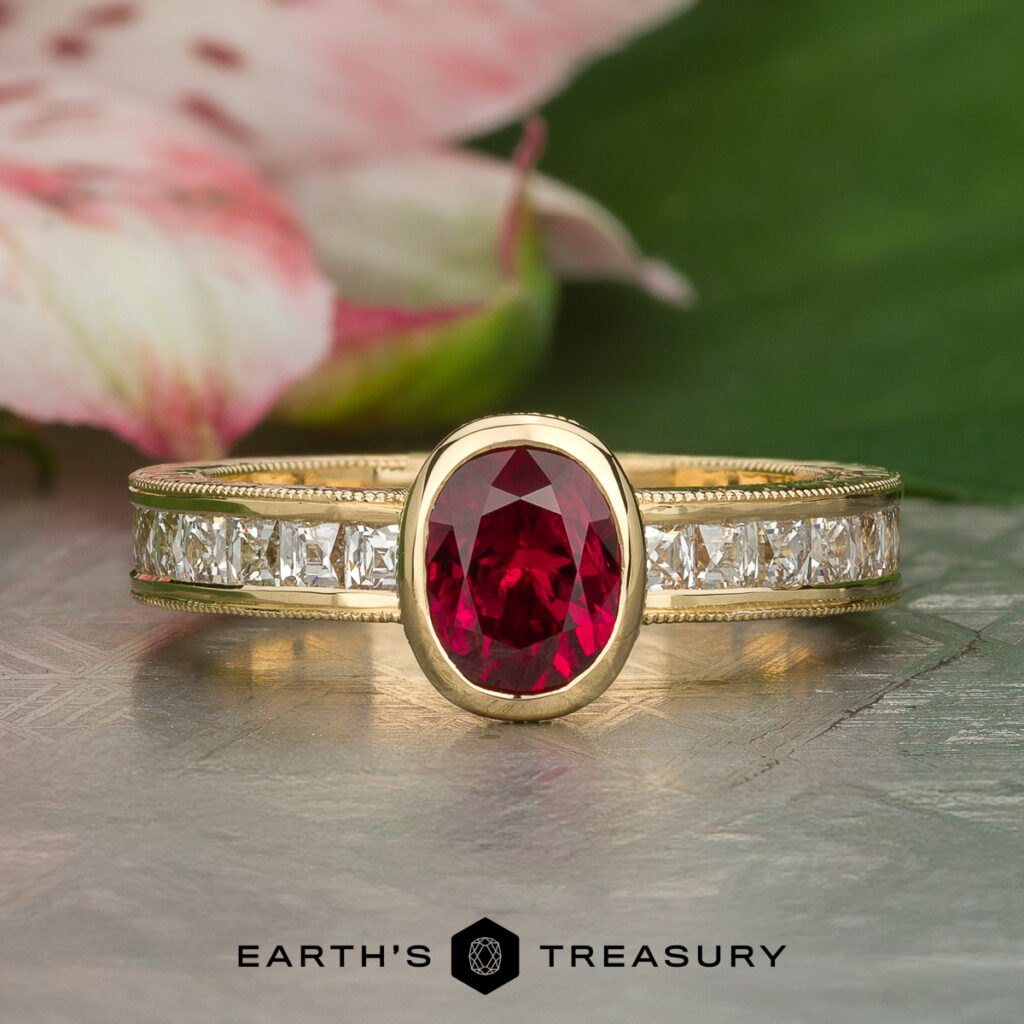 The "Stacked from 25 images. Method=B (R=14,S=2)" gold ring features an oval red gemstone at the center and square white diamonds on the band, showcased against a green leaf background.
