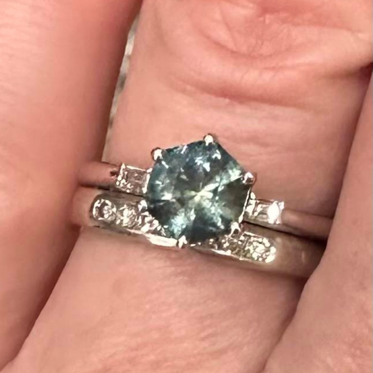 The "Bridget" ring in platinum with 1.32-carat Montana sapphire, alongside band not made by Earth's Treasury