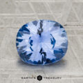 A 2.88-carat Ceylon sapphire with a cushion cut is shown on a textured gray surface, featuring the "Earth's Treasury" text below.