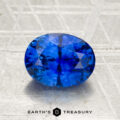 A 2.07-carat heated Ceylon sapphire, faceted in an oval shape, displayed on a textured surface with "Earth's Treasury" at the bottom.