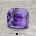A 3.06-carat Ceylon sapphire with a cushion cut is shown on a textured gray surface, featuring the text "Earth's Treasury" at the bottom.