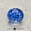 A 2.27-carat heated Ceylon sapphire, round brilliant-cut, displayed on a patterned metallic surface with the text "EARTH'S TREASURY" below.