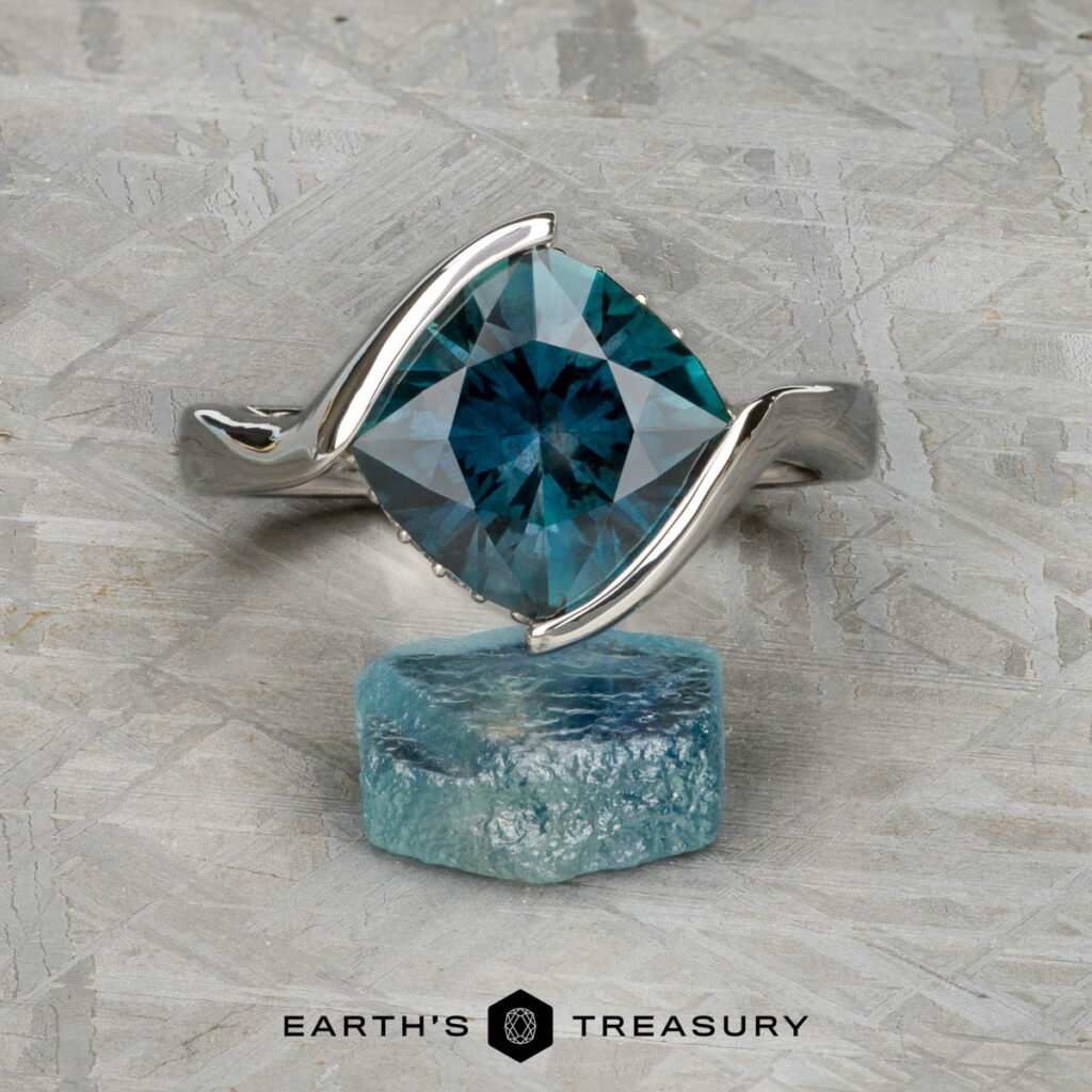 The custom gallery "Wong, Stephen 1" features a silver ring with a square-cut blue gemstone beside a raw blue stone on textured gray, with "EARTH'S TREASURY" displayed at the bottom.