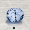 A 2.24-carat Ceylon Sapphire, round brilliant-cut and blue, is displayed on a textured metallic surface with the "EARTH'S TREASURY" logo and text at the bottom.