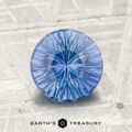 A round, faceted 1.89-carat Ceylon Sapphire gemstone is displayed on a textured gray surface with the text "Earth’s Treasury" at the bottom.