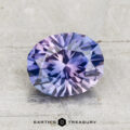 2.18-carat Montana sapphire (heated) with a blue and purple color gradient, faceted oval, displayed on a light textured surface; "Earth's Treasury" logo beneath.