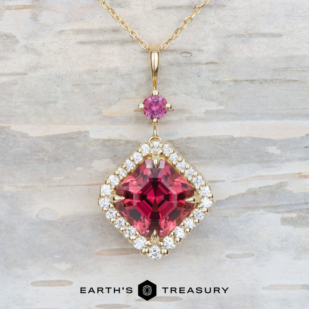 The Pintea, Victor 2 necklace features a large square pink gemstone pendant accented with small diamonds and a round pink stone above, showcased against a light textured background.