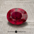 A 2.20-carat ruby, faceted in an oval shape, rests on a textured metallic surface with the Earth's Treasury logo and text below.